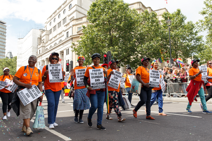 Ugandans march in a parade for LGBT+ rights