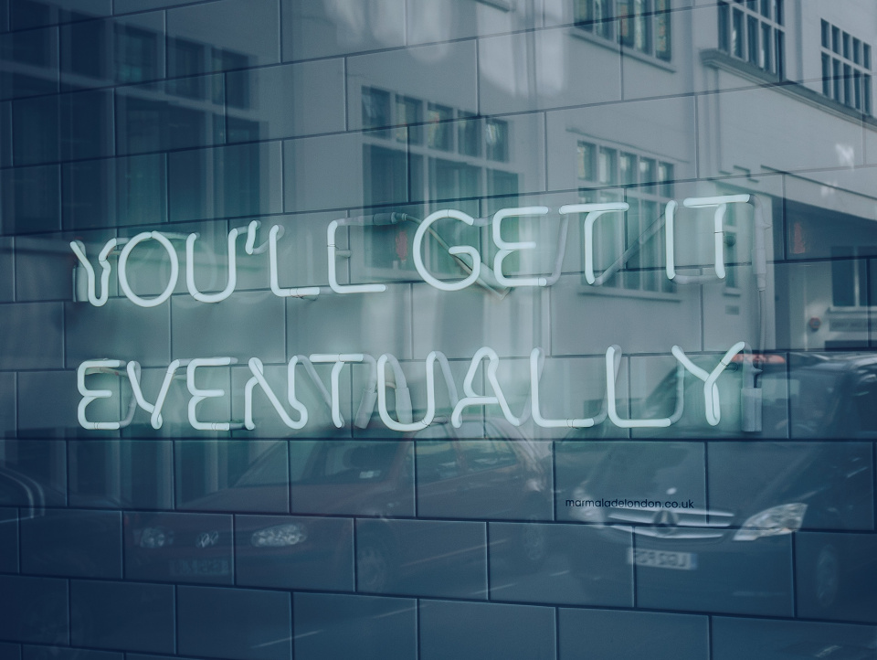 Neon sign that says "you'll get it eventually"