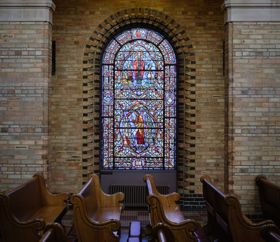 church pews with stained glass