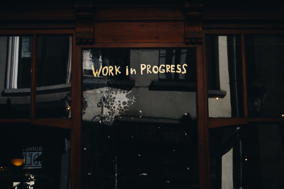 sign that says "work in progress"