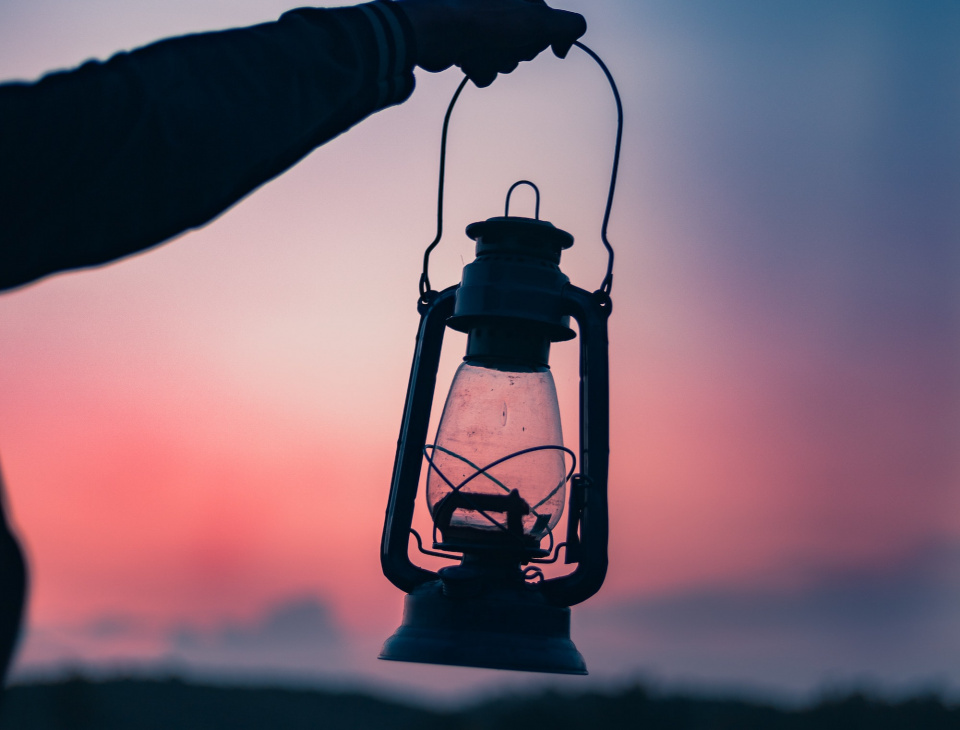 person holding a lantern