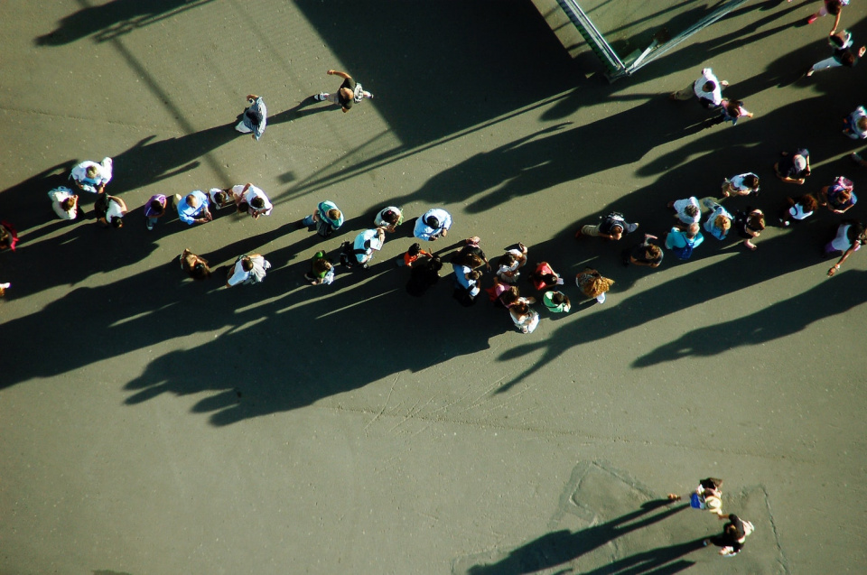 a view from overhead of people standing in line