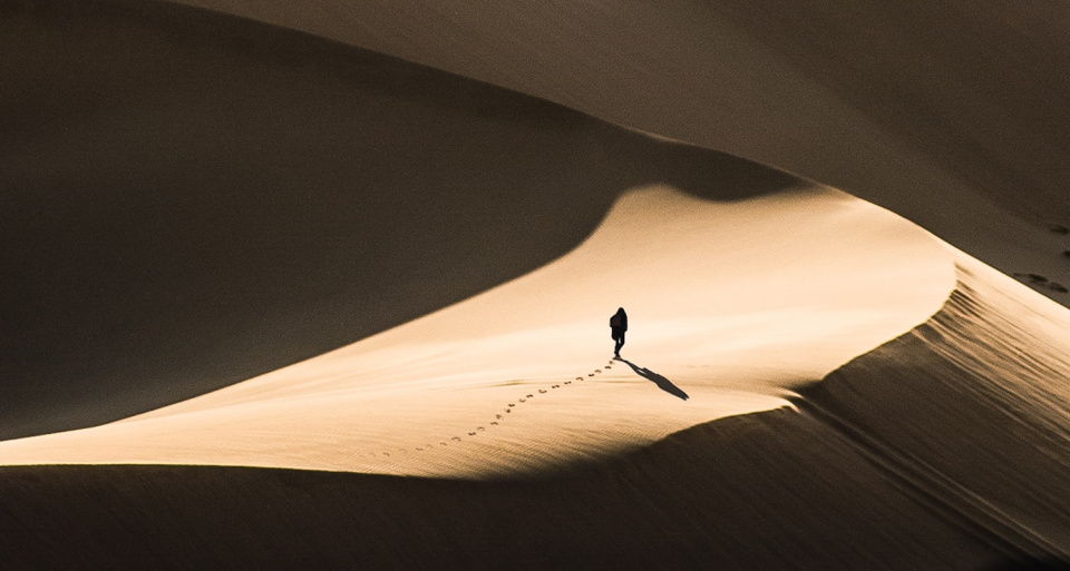 Person walking in a desert