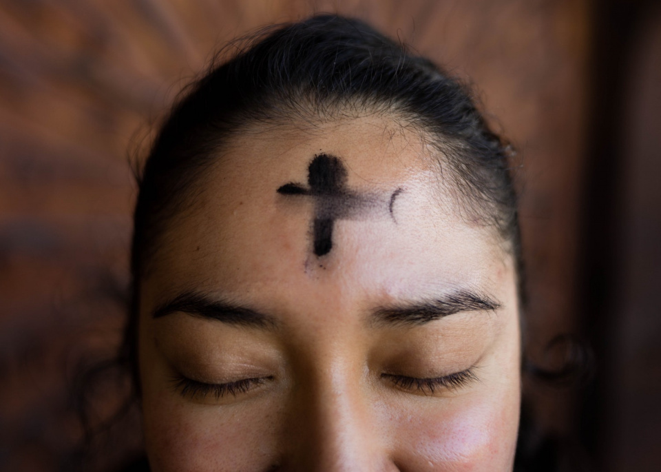 Woman with ashes on her head