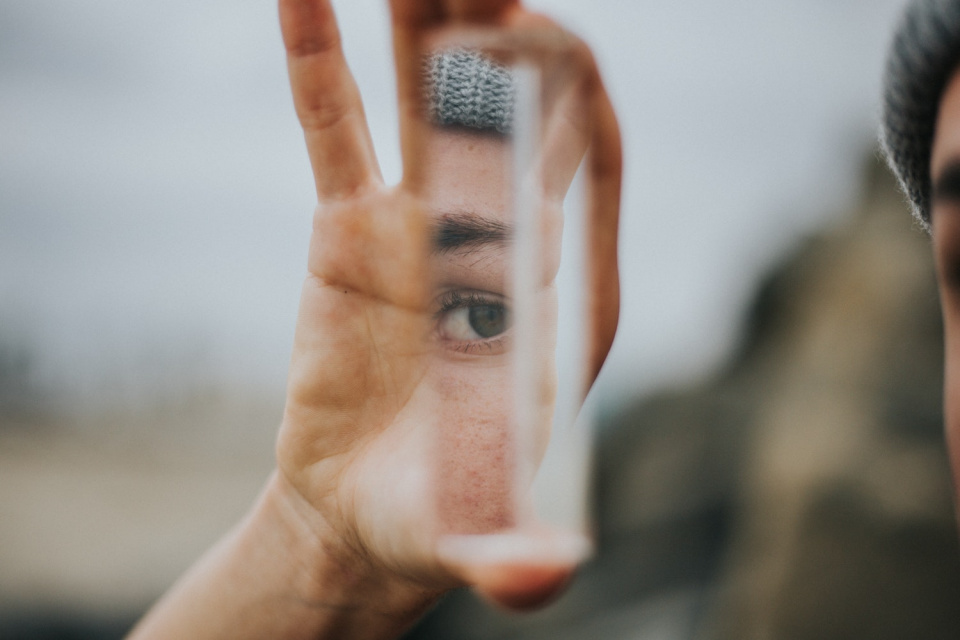 Piece of glass reflecting an eye