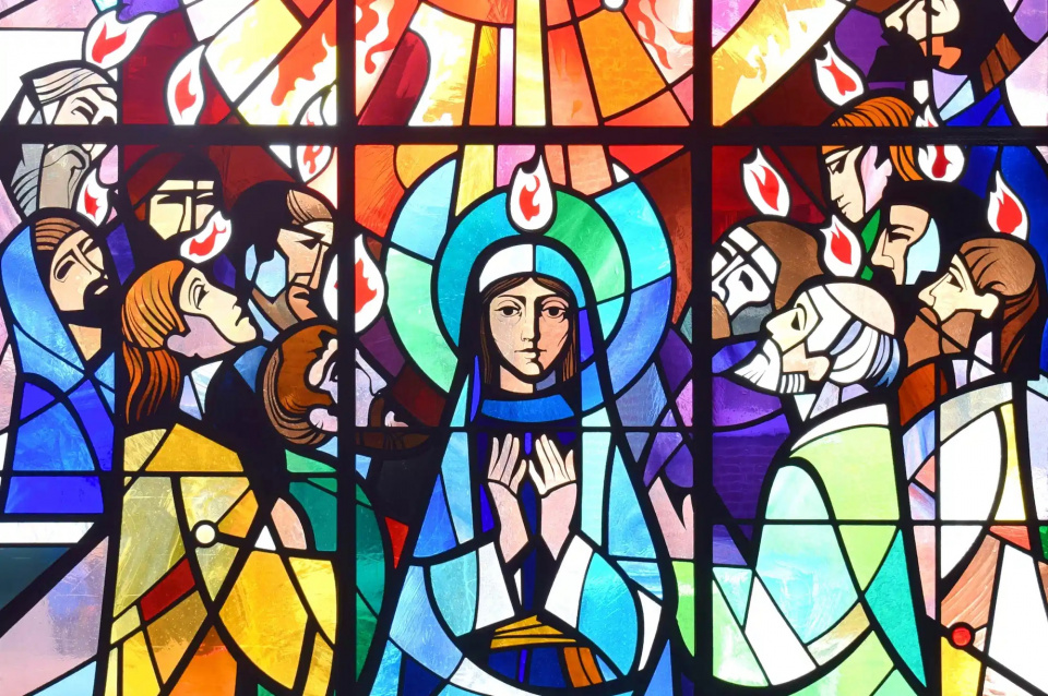 Image of a work of stained glass showing the disciples receiving the Holy Spirit