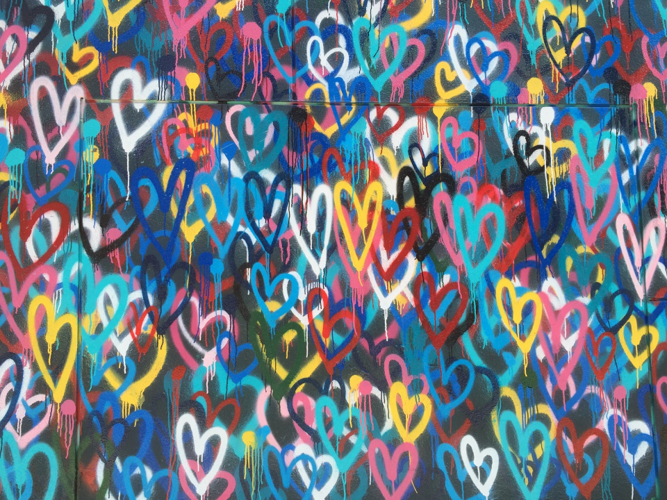colorful graffiti hearts on a wall