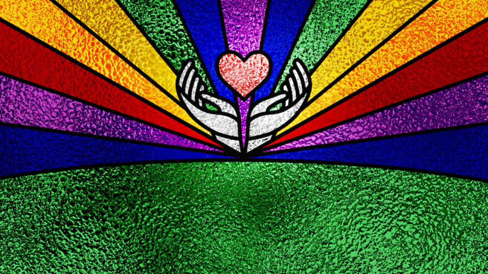 Stained glass with hands holding a heart against the backdrop of a rainbow
