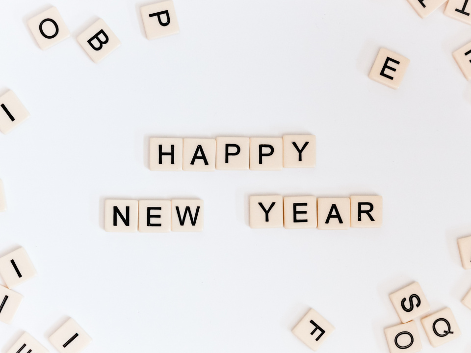 Scrabble tiles spelling out "Happy new year"