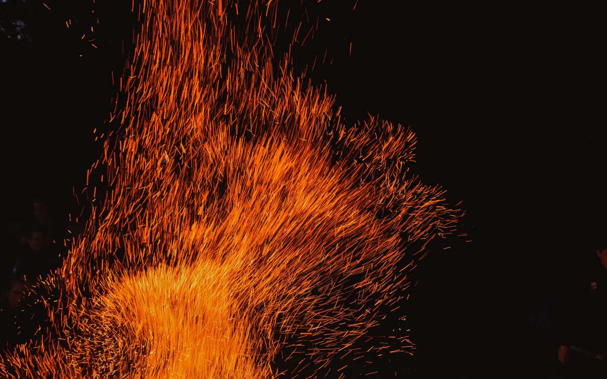 A photograph of a bonfire against a black night sky, taken in Dunedin, New Zealand by Krystle van der Salm