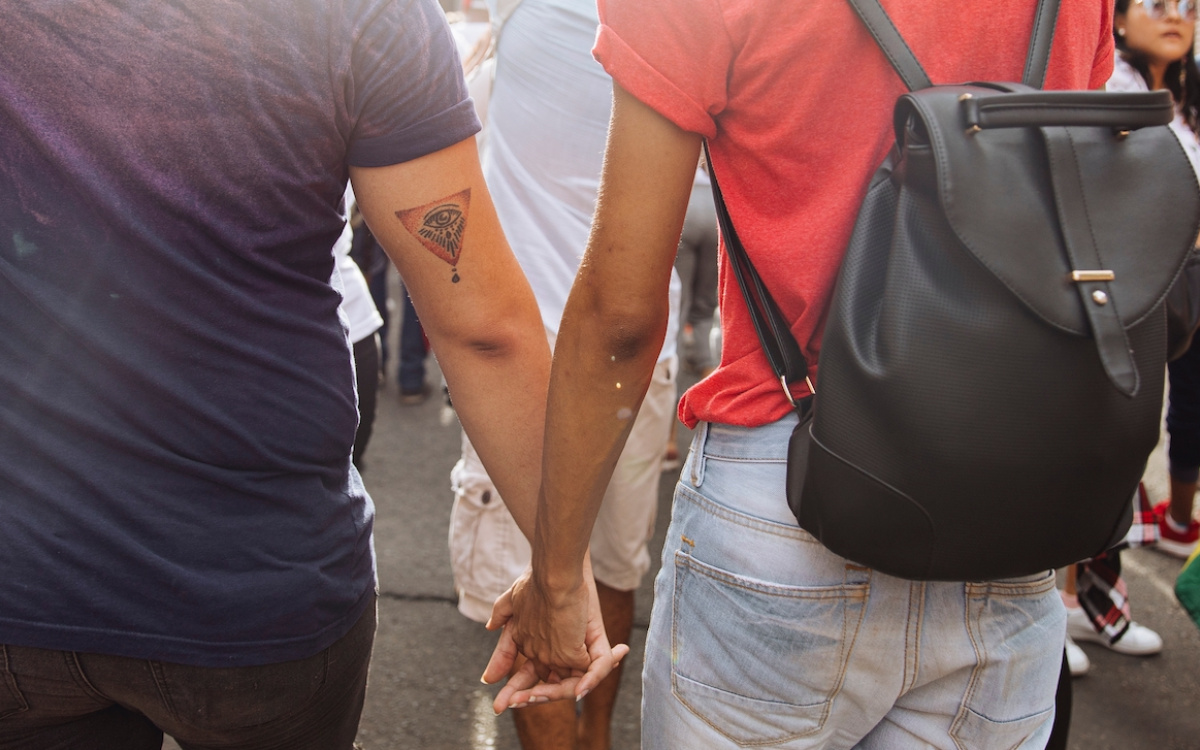 photo of two people holding hands